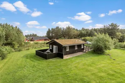 a small house in the middle of a field at LK2098-Lokken-Magdalenevej-51 in Løkken