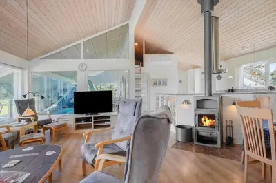 a living room with a television and a fireplace at LK781-Lokken-Margrethevej-6 in Løkken