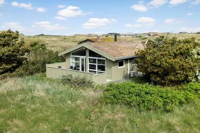a small house in the middle of a field at LK539-Lokken-Sylviavej-27 in Løkken