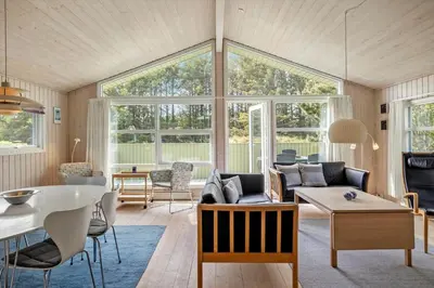 a living room with a couch and a table at LK539-Lokken-Sylviavej-27 in Løkken