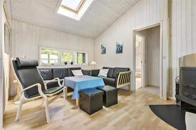 a living room with a couch and a table at LK552-Lokken-Ornegaardsvej-14 in Løkken