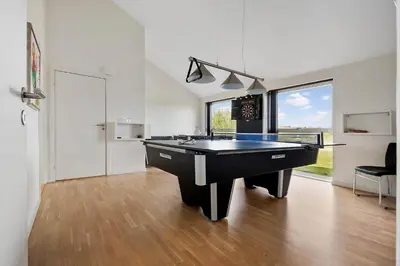 a large white room with a pool table in it at LK1979-Lokken-Kringelbaekvej-42 in Løkken
