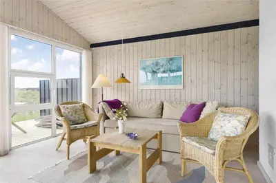 a living room with a couch and two chairs at LK157-Lokken-Ruthsvej-15 in Løkken