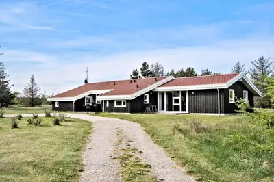 a house with a dirt road in front of it at LK350-Lokken-Piasvej-11 in Løkken