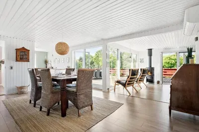 a dining room with a table and chairs at LK1935-Lokken-Pernillevej-17 in Løkken