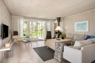 a living room with a couch and a table at LK344-Lokken-Ragnhildsvej-3 in Løkken