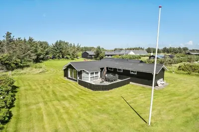 an aerial view of a house with a large yard at LK2071-Lokken-Marensvej-3 in Løkken