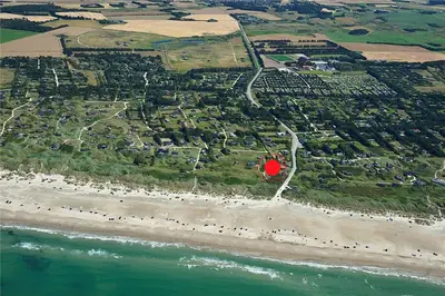 an aerial view of a beach with a red island at LK1790-Lokken-Gronhoj-Strandvej-174 in Løkken