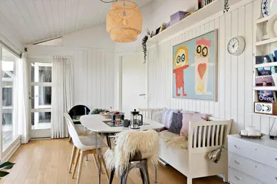 a living room with a table and a couch at LK1790-Lokken-Gronhoj-Strandvej-174 in Løkken