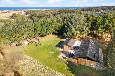 an overhead view of a house on a field with trees at LK741-Lokken-Madsinesvej-1 in Løkken