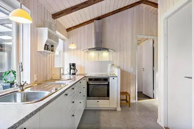 a kitchen with a sink and a stove top oven at LK741-Lokken-Madsinesvej-1 in Løkken