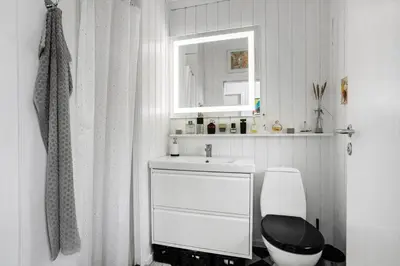 a bathroom with a white sink and a toilet at LK847-Lokken-Odavej-59 in Løkken