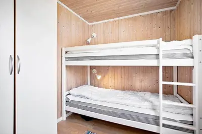 a bunk room with two bunk beds in it at LK1779-Lokken-Lydiavej-2 in Løkken