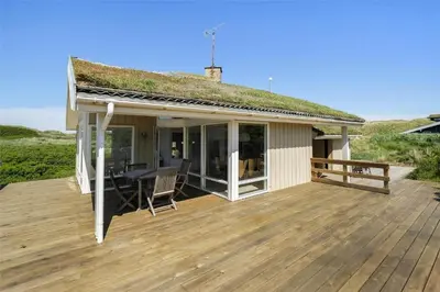 a house with a deck with a grass roof at LK1716-Lokken-Marthasvej-28 in Løkken