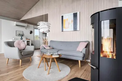 a living room with a couch and a table at LK2033-Lokken-Madsinesvej-13 in Løkken
