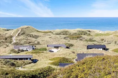 a group of houses on a hill near the ocean at LK1847-Lokken-Ornegaardsvej-17 in Løkken