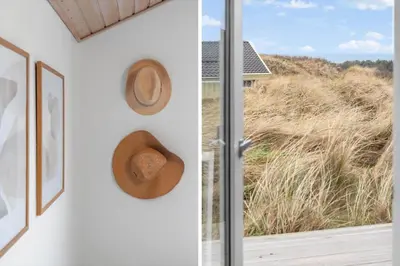 a room with a window and a hat on the wall at LK326-Lokken-Monasvej-31 in Løkken