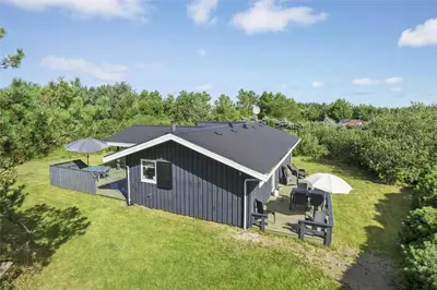 an overhead view of a building with chairs and umbrellas at LK1221-Lokken-Louisevej-5 in Løkken