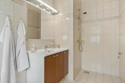 a bathroom with a sink and a shower at BL1220-Blokhus-Peter-Andersensvej-21 in Blokhus