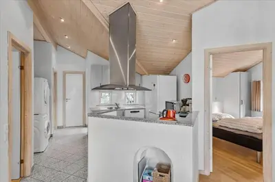 a kitchen with a sink and a stove at BL1736-Blokhus-Slettevej-3 in Blokhus
