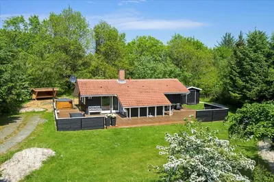 a large house with a large yard with a yard at BL1402-Blokhus-Bag-Hojen-57 in Blokhus