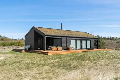 a black house sitting on top of a field at BL1642-Saltum-Bondagervej-50 in Saltum
