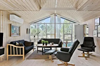 a living room with a couch and chairs and a table at BL1789-Saltum-Krogsletten-20 in Saltum