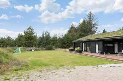 a house with a large yard in front of it at BL1635-Blokhus-Lyngdraget-19 in Blokhus