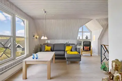 a living room with a couch and a table at BL116-Saltum-Revlingevej-44 in Saltum