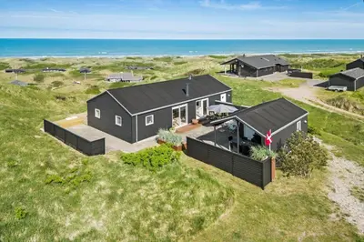 an aerial view of a house on the beach at LK553-Lokken-Rosavej-7 in Løkken