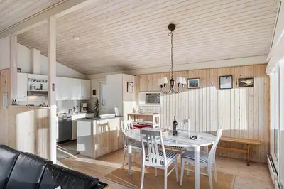 a kitchen and dining room with a table and chairs at BL1265-Saltum-Faaborgvej-7 in Saltum