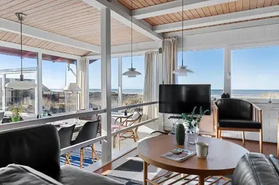 a living room with a view of the ocean at LK2130-Lokken-Lottesvej-23 in Løkken