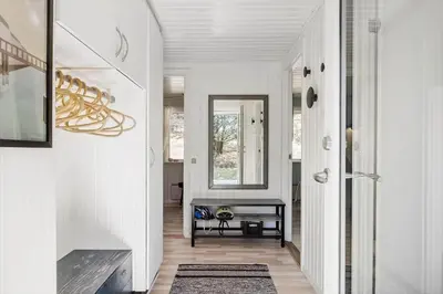a hallway of a home with white walls and wood floors at BL1131-Saltum-Daadyrvej-11 in Saltum