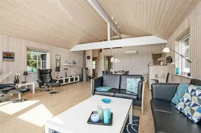 a living room with a couch and a table at BL704-Blokhus-Soren-Petersvej-7 in Blokhus