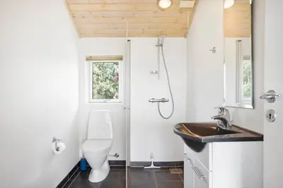 a bathroom with a toilet and a sink at BL512-Saltum-Trehoje-2 in Saltum