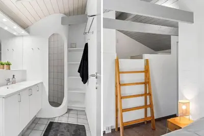a white bathroom with a ladder and a sink at BL1375-Blokhus-Klitvejen-15 in Blokhus