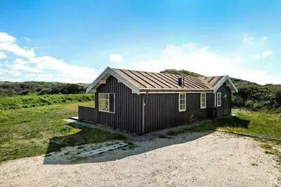 a small house sitting on top of a field at BL1241-Saltum-Bondagervej-2 in Saltum