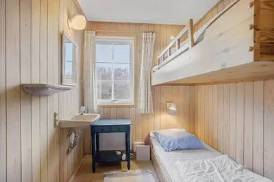 a bedroom with a bunk bed with a sink and a bunk bed at BL1241-Saltum-Bondagervej-2 in Saltum