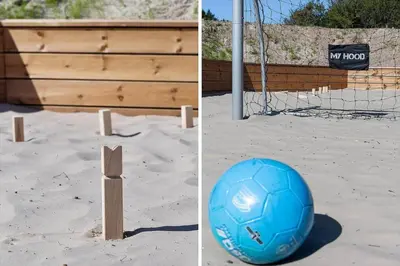 a soccer ball in the sand next to a goal at LK2146-Lokken-Redningsstien-2 in Løkken