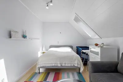 a small bedroom with a bed and a desk at BL1454-Pandrup-Rodhusvej-215 in Pandrup