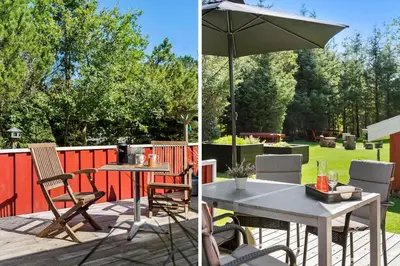 a patio with a table and an umbrella at BL1092-Saltum-Doggerbanke-2 in Saltum