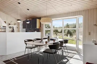 a kitchen and dining room with a table and chairs at BL209-Saltum-Silkeborgvej-6 in Saltum
