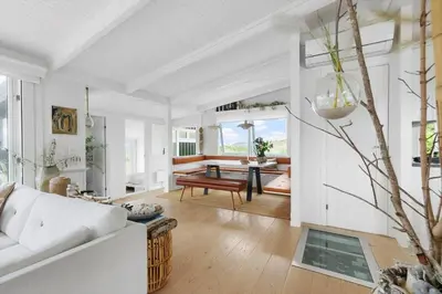 a living room with a white couch and a table at LK2173-Lokken-Ruthsvej-9 in Løkken