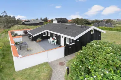 an overhead view of a black and white house at BL1587-Blokhus-Karnoevej-1 in Blokhus