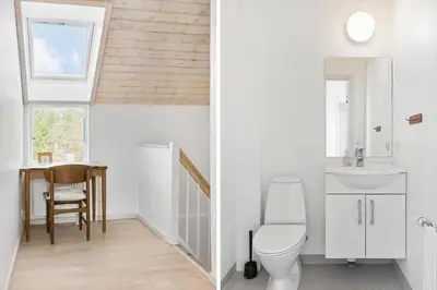 a bathroom with a toilet and a sink at BL1619-Blokhus-Klitheden-Nord-42 in Blokhus