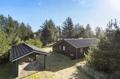 a small cabin in the middle of a yard at BL1716-Saltum-Viborgvej-2 in Saltum