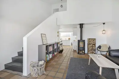 a living room with a couch and a table at BL1538-Blokhus-Ferren-42 in Blokhus
