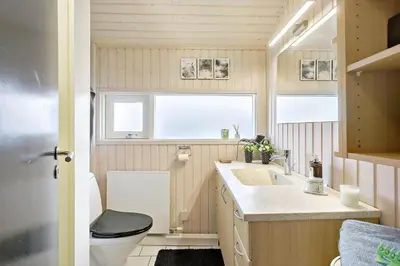 a small bathroom with a toilet and a sink at BL1566-Saltum-Lille-Fiskerbanke-3 in Saltum