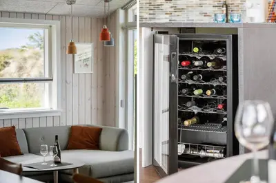 a living room with a wine cabinet filled with wine bottles at BL1470-Saltum-Faaborgvej-6 in Saltum