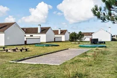 a group of buildings with trampols in a field at BL1775-Pandrup-Rodhus-Klitvej-335 in Pandrup